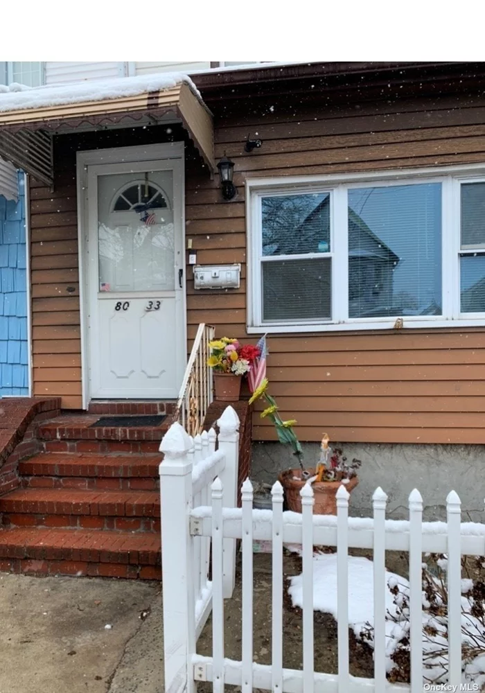 Cozy Woodhaven home with shared driveway and fenced in yard. Three bedrooms, 1 and 1/2 baths, large living room, formal dining room and eat in kitchen. Partially finished basement and walkup attic,