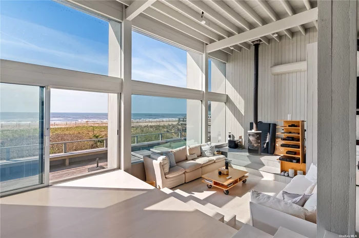 Enjoy breathtaking panoramic beachfront views on Fire Island&rsquo;s most desirable location. This 4 bedroom, 3 full baths home can comfortably accommodate your extended family and guests. On the second floor you will find an open concept living area including kitchen, dining, and step down living room with a wood stove for those pre/post season days. stunning valued ceiling and floor to ceiling glass overlooking the ocean. Primary bedroom is situated off the main area with its own private bath with a sunken stainless steel jacuzzi with ocean views. The other 3 bedrooms are all on !st floor with private deck space. Additional amenities include AC/Heat units, sound system, outside shower, plenty of closets and storage areas. Large south facing deck over looking the ocean. This is a rare opportunity to live directly on the beach! Dunewood and Atlantique ferry just a short walk away.