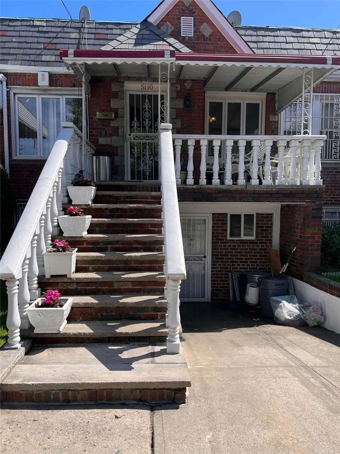 Beautiful Legal 2 family Brick Townhouse with sunken living room, large dining room, working fireplace, updated kitchen with stainless steel appliances and granite countertops, top floor with patio deck. Two bedrooms and one bath on each floor. Ground floor has great rental potential. A must see!!