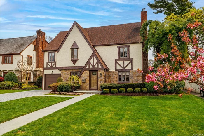 On a quiet dead-end street in Old Canterbury, this stunning Tudor is an absolute must see and is a home that you can move right into. It has had a Full Home Renovation right down to the Studs and features a Custom Kitchen with adjoining Mudroom/Butlers Pantry that lead to the garage. All the bathrooms have been renovated and have Custom Cabinetry. Heated Floors in the Entry, kitchen, mud room, family room and in all the bathrooms.  Hardwood floors throughout, new wiring, plumbing, heating & air conditioning, Expanded driveway to accomodate 4-Car Parking, New Front Walk and back patio, Gas line for Barbeque Grill,  gas fireplace in the Living Room and a wood-burnig fireplace in the lower level that has proper egres. The manicured yard is a private retreat to enjoy all summer. Taxes are being grieved.