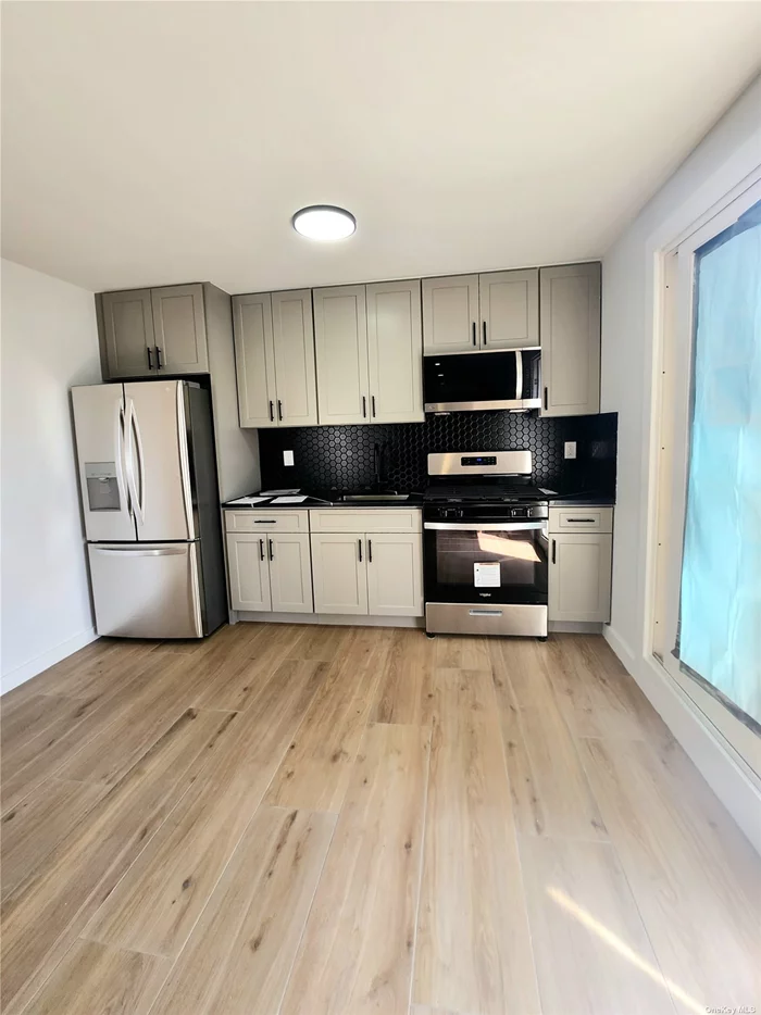 Fully Renovated First Floor Apartment. Three bedrooms, 1 bathroom, all new appliances,  access to a private backyard and a parking space. All utilities are included. If tenants want to keep and use the washer and dryer in the apartment, an additional $200.00 fee a month will needed.