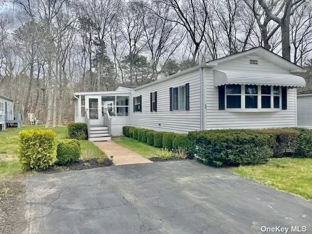 Come And See This Beautiful, Meticulously Maintained Manufactured Home In East Quogue Community Family Park. Perfectly Located On Dead End Street. Backs To Preserved And Oversized Lot Makes This Unit Very Desirable. Throughout Oak Floors, High Ceilings And Freshly Painted Interior Enhance The Welcoming Atmosphere. Updated Eat In Kitchen With Stainless Steel Appliances And Tile Floors. Oil Heat And Propane Gas For Cooking. Two Bedrooms And Two Full Bathrooms. Futures Large Enclosed Porch And Two Car Driveway With Additional Off Street Parking. Updates Also Includes Central Air Conditioning, New Water Heater, New Furnace And Oil Tank. Low Lot Fee Of $601.00 Includes Garbage Removal, Street Snow Removal, Water, Taxes And Septic Maintenance. Desirable East Quogue/ Westhampton School District. Close To Parks, Beaches, Restaurants, And Stores. Don&rsquo;t Miss Out On This Amazing Opportunity Of Affordable Living!.