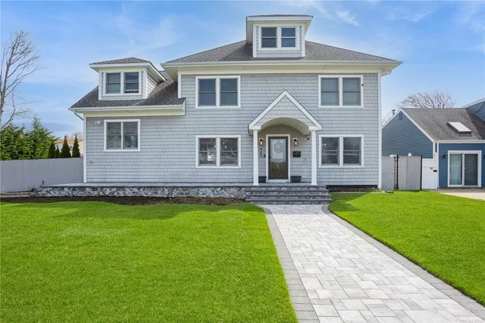 Experience the tranquility of 465 Bay Avenue in Patchogue, NY, with captivating water views of the Great South Bay! This charming home features 3-4 bedrooms, 2 bathrooms and 2400 + - sq ft of comfortable living space. Boasting an open concept floor plan, kitchen with granite counters & ss appliances, wood burning stove, radiant tile flooring, crown moldings, hardwood floors, Andersen windows, newer roof/siding/gutters (5 yrs), natural gas, 200 AMP service, plus more. Step outside to enjoy the new paver walkway & porch, inground sprinklers, trex patio and a secluded yard lined with arborvitaes. Close proximately to fine waterfront dining, Shorefront park, Fire Island ferry, public pool or the bustling downtown Patchogue! Schedule a showing today and make this beauty your own!