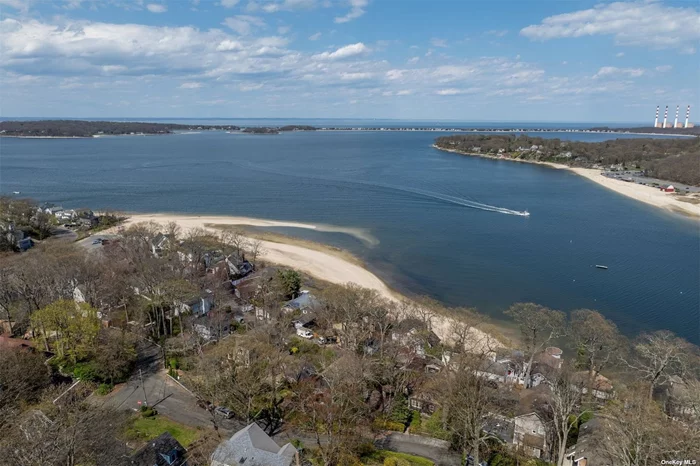 Location, location! Spectacular year-round panoramic WATER VIEWS of Centerport Harbor, Northport Bay, Asharoken, and Eatons Neck. Nestled amongst tall trees & lush plantings, this 80ft wide double lot features hand-crafted slate walls, meandering stone pathways and several entertaining areas, all with unobstructed water views. The property extends from McKinley Terrace up to Jackson Crescent, affording additional parking and convenient access to and from both streets! The huge detached screened 4 season party room is the crown jewel of the property, complete with jalousie windows, a wood burning stove, pool table, sitting area and ambient lighting that gives the room a warm glow in the evening. There is also a gazebo, shed and one car detached garage. Residents have the option to join the private Huntington Beach Community Association (HBCA) with its soft sandy beach, access to boat launch, moorings, kayak/dinghy storage, a clubhouse for parties and numerous amenities and year-round events including Summer Camp, Lobsterfest, Octoberfest, Family Day, 4th of July celebrations, and many more. All just a short walk down the hill towards the water! If your dream is to live by the beach with panoramic water views that sparkle from the sun and glimmer from the moon, welcome to 570 Mc Kinley Terrace!