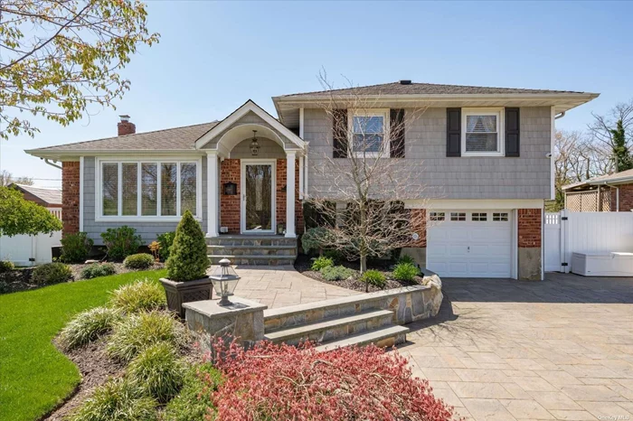 Welcome to your dream home in Farmingdale! This custom split-level property boasts unparalleled features that set it apart from the rest. As you approach, you&rsquo;re greeted by a meticulously landscaped front yard with a sprawling paver driveway and walkway leading to the entrance of this 3-bedroom, 2-bathroom gem. Step inside to discover gleaming hardwood floors throughout, a custom-designed kitchen adorned with stainless steel appliances, and luxurious granite countertops. Unlike other split-level homes is its fully finished basement, featuring tile floors and LED recessed lighting-a perfect space for a movie room, den, or playroom. Escape to your own private oasis in the backyard, complete with lush privacy hedges, pavers, and a stunning inground pool. Entertain guests on the expansive deck or unwind at the custom-built cabana bar, equipped with electric amenities, ceiling fans, an outdoor TV, and cozy wooden swing chairs. This home is packed with modern amenities, including central air, updated LED recessed lighting, and a state-of-the-art heating system. Plus, enjoy the convenience of outdoor cameras and speakers for added security and entertainment. With its countless custom features and meticulous attention to detail, this home is truly move-in ready for those who appreciate quality craftsmanship. Welcome home to your slice of paradise!