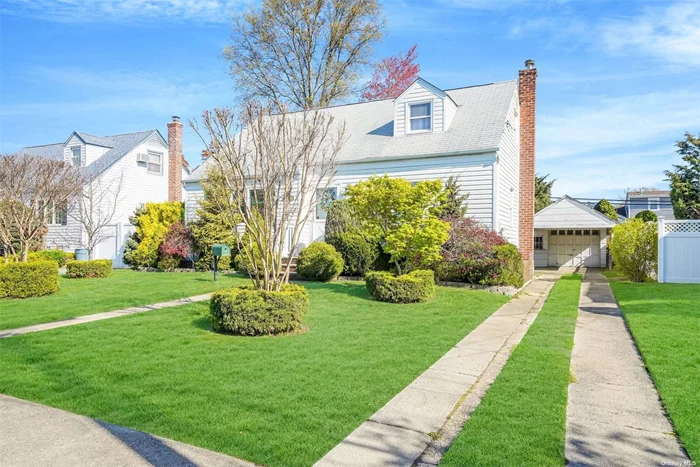 Beautiful Cape home ideally located mid block - Franklin Square schools. Updated kitchen, Updated bath, Updated Heating System, Brand-New Hot Water Heater, Hardwood Floors Throughout 1st Floor, 4--Car Driveway W/ 1-Car Detached Garage, Laundry Room In Basement Gas cooking and gas heat