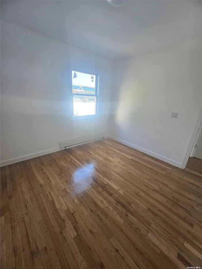 Recently Renovated 2BR Apt All utilities Included In 2nd FL of Two Family Home One Block to 7 Train Station.
