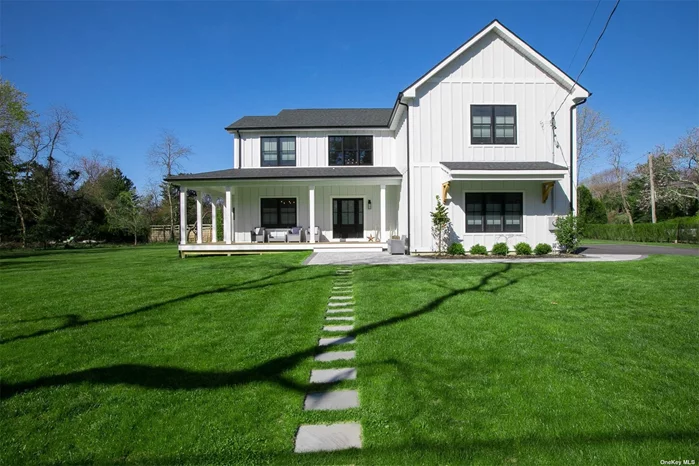 Newly Built 3, 000+ Square Foot Modern Farmhouse on Large Lot in Pristine Tuthill Point in East Moriches, Just minutes from The Hamptons. A short walk to Tuthill Cove and Moriches Bay. The Exterior is Adorned by Timeless Aspen White Board & Batten Siding Accented with Black Anderson Windows and Wrap-Around Porch and Two Car Garage with Extensive Interlocking Paver Patio Walkways and Patio, Fully Landscaped with 12 Zone In-Ground Irrigation Included as well as Automated Driveway Gates with Intercom. The Interior Boasts a Grand Double Height Entry Foyer, Gas Fireplace, Fine Oak Flooring, 9-foot ceilings throughout the first floor, Kitchen includes Custom Cabinetry and Stone Tops, Farm Sink with Energy Star rated Bosch and Sub-Zero Stainless-Steel Appliances and Huge Center Island, as well as a Spacious Walk-in Pantry and Laundry Room, First Floor Master Suite and an additional 4 Spacious Second Floor Bedrooms. Westhampton High School. This House Has Been Finished to Perfection!