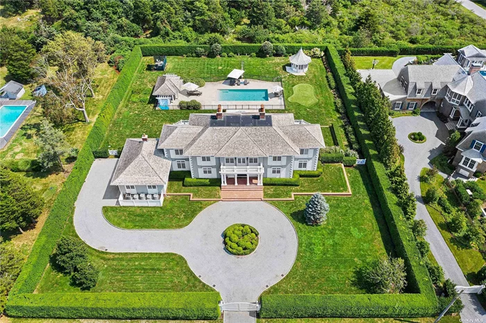 Located in one the premiere spots in Quogue South you&rsquo;ll find this stunning 6 bed/5 & 1/2 bath traditional home built in 2007. The interior boasts close to 6, 500 sq ft of living space with an open floor plan, true gourmet chefs kitchen, formal dining, living room, screened in porch, 1st floor primary bedroom, 2 car garage, balconies looking over the expansive property, & multiple French doors which lead to the backyard. There you&rsquo;ll find and over sized heated gunite pool, pool house with kitchenette & bath, detached office/studio, & sprawling lawn area surrounded by the manicured hedges. Your Quogue rental awaits.