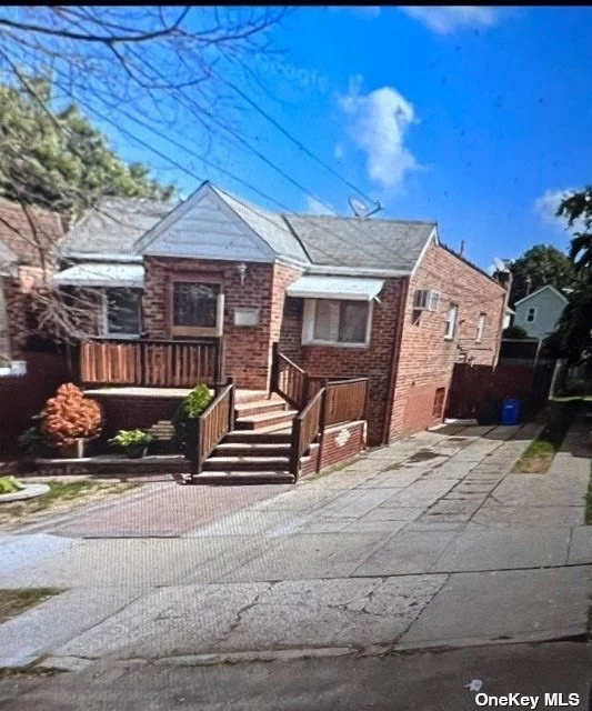 Updated Brick 2 Family House. Convenient South Ozone Park Location. Rear Yard and Large Driveway for Parking Stainless Steel Appliances in Main Unit,  Close to Transportation and JFK Airport.