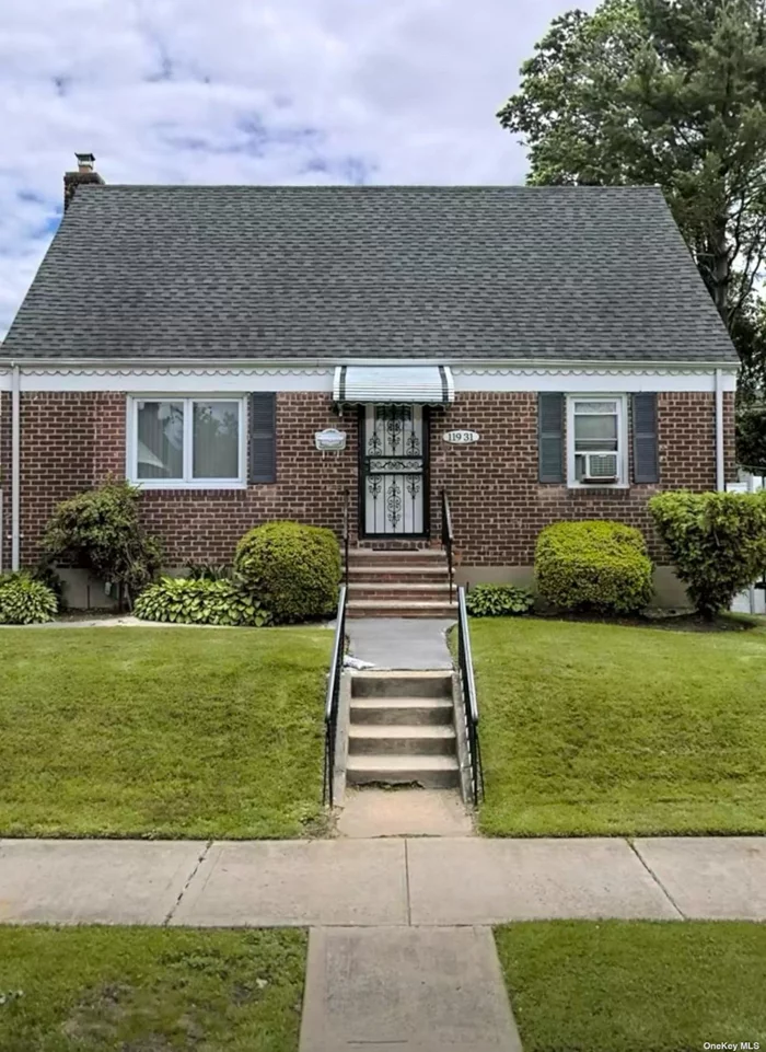 Beautiful updated brick cape with a detached garage located in desirable Cambria Heights. Home features hardwood floors, 4 bedrooms, living room, kitchen, dining area and a full finished basement with an outside entrance. Located near stores, parks, highways and public transportation.