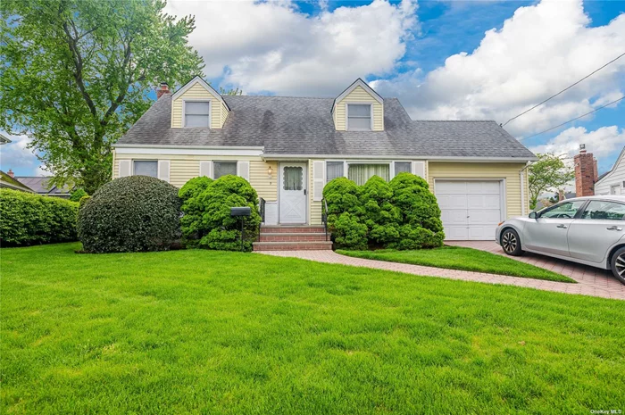 Expanded cape in Massapequa Park on perfect residential street in Massapequa school district.  Amazing main level den with fireplace, kitchen with dining area with exit to deck and yard, formal living room and full finished basement. Amazing opportunity!!!