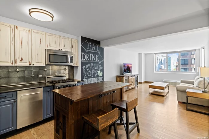 If a unique, custom-crafted 1BR unit with an island kitchen, meticulously renovated bath, and deep walk-in closet fills you with unbridled joy, this north-facing approximately 740 SF apartment may just be your NextHome! And as a bonus, any or all of the pictured furniture can remain in the unit upon your request at no additional charge. First stop is your illuminated entry walk-in closet-the first of four generous closets-for a wealth of storage space rarely found in Manhattan. Next, the stainless island kitchen is one-of-a-kind: beyond the stainless appliances, corner undermount sink with gooseneck fixtures, stone counters, blackboard illustration space, and custom backsplash, the woodworking is a wonderful combination of distressed and solid cabinets with the most amazing storage island you have ever seen. Moving beyond the open plan kitchen, the living room with northern exposure and mounted modern wall lighting is expansive and bright, while the oversized master bedroom with more wall lighting and custom built-ins to complement the full wall closet can easily accommodate large bedroom furniture, a substantial home desk, and more. Final stop, the modern bath was masterfully designed with natural tones and delivers the most amazing vanity, glass-enclosed walk-in shower, incredibly detailed tile work, and both a lamppost light fixture and recessed lighting. Plank flooring has been deployed throughout and, for a touch of climate technology, two through-wall PTHP units with wireless thermostats (upgradeable to Wi-Fi) were installed in 2021 for energy-efficient heating and cooling. Easily accessible from the FDR Drive, under a block from the closest entrance to the Q Express subway station, and only moments away from Carl Schurz Park and Gracie Mansion, Mill Rock Plaza is a full-service, luxury cooperative in the Upper East Side neighborhood of Yorkville. Amenities are abundant, including 24-hour concierge coverage of dual entrances, staff of eleven including a live-in resident manager, renovated lobby and hallways, laundry room on every floor, bike room, package room, residents-only fitness center, landscaped and furnished sun deck, and attached garage with secure entry. This unit, which supports Verizon FiOS, Spectrum, and Astound, is available upon the completion of a well-organized application process. Sorry, no pets allowed.