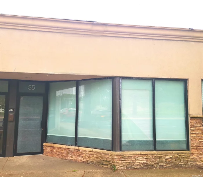 A stunning first-floor storefront space with excellent visibility and exposure, strategically located on the heavily trafficked Sunrise Highway, close to all major transportation, easy and convenient parking, suitable for any type of business, one large room with two additional rooms or offices, a kitchenette, and an overhead door in the back. Immediately available