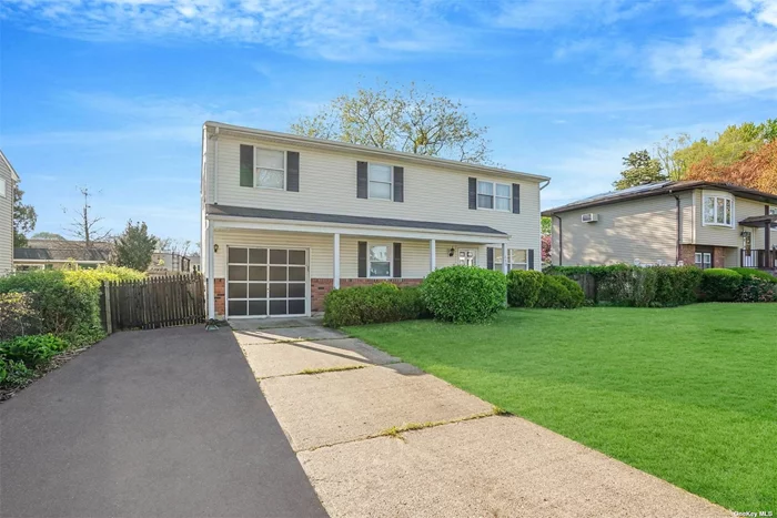 Spacious 5 Bed / 2 Full Bath Colonial! Featuring hardwood floors, a bright and airy living room & dining room combo, family room/den area, attic for extra storage, and more! Close To Highways, LIRR, Shopping, Parks, And Most Amenities.