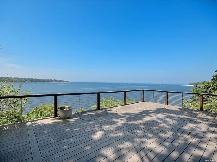 Enjoy Direct Waterfront Living In This Picture Perfect 8 Room Colonial With Views Across Long Island Sound To The Connecticut Shoreline. This Home Features Gourmet Eat In Kitchen, Den With Stone Fireplace, Formal Living Room, Primary Bedroom With Fireplace & Floor To Ceiling Windows Overlooking The Harbor. Large Private Deck & Private Beach For Your Outdoor Entertaining . Close Proximity To Sea Cliff Elementary School, Library, Upscale Dining, Golf, Tennis, Parks, Long Island Rail Road, Highways & Parkways. Home Will Be Freshly Painted This Week.