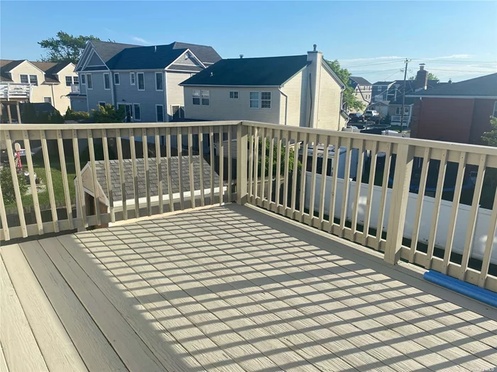 Sunny and Spacious Freshly Painted 3 BR with Balcony Terrace and Bay Views, Granite Kitchen with Wood Cabinetry. Hardwood and Tile Floors throughout. Primary Bedroom will Have Brand New Carpet, New Doors, Dining Room, Yard Use. Close to village pool, beach, docks, and restaurants. Shared Washer/Dryer