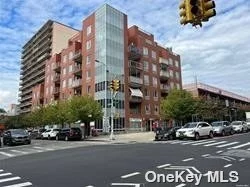 The building in downtown Flushing. This Excellent condition 2Br 2Bath condo, With New Kit, New Bathroom, Hard wood floor, Washer and Dryer in the unit and balcony. Building has doorman service 9:30am to 10pm. Short walk distance to main St. Convenience To All.