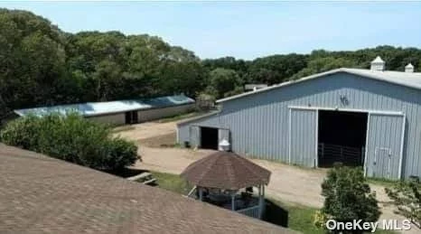 Opportunity Knocks w/ this 9.5 Acre Horse Farm located off the LIE which has been here for over 40 Years. 3 BR Ranch, 27 Stall Barn w/ 2 Tack Rms, Office, Bath & Indoor Shower Stall. There is a 16 Stall Barn w/ a Tack Rm & attached Indoor Arena 90x170, w/ viewing Rm & Judges Rm. The Side Barn has 12 Stalls, an 8 Stall Barn. Total of 63 Stalls plus 5 In & Outs. 35 Turn Outs for Horses, 3 Outside Arenas & just minutes to open trails that are great for an hour in the woods. Property has Frost Free Hydrants throughout, Storage Sheds, a Container & a Tractor Trailer Box used to store Hay & Shavings. Agriculture Zoned Property w/ options to grow your own crops, SOD Farm & Plants. Sub- Dividable Land for Contractors to build. Business is currently operating Full board & Rough board, Make your own Dream come true to own almost 10 Acres here on Long Island w/ easy access to the LIE here in Medford & a short ride to the Hamptons! Taxes w/ Agricultural exemption is $35, 698.75 A LEASE IS AVAILABLE UPON REQUEST