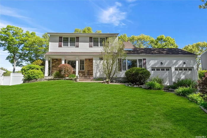 Experience the epitome of suburban living in this classic Smithtown Colonial! Pull up onto your expanded diveway with belgium block border, then walk up the paver walkway to a welcoming front porch accented with a stack stone wall. Step outside to your back yard paradise featuring a 36&rsquo;x14&rsquo; trex deck, a 18x35&rsquo; IG pool with paver patio surround, and a hot tub for year-round relaxation! Primary suite features expanded full bath with huge shower. Additional Entertaining space in your full finished basement with built-in wet bar. Expanded kitchen boasts open concept to dining room, large center island, ceiling height cabinets, granite countertops and stainless steel appliances. This home has it all!