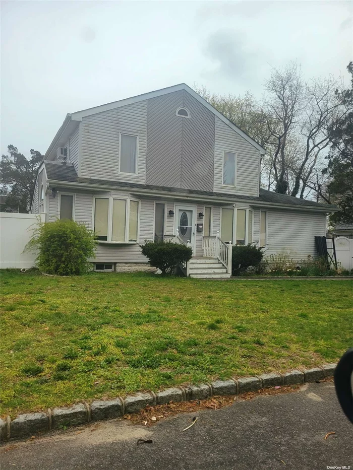 Renovated 3-bedroom Colonial with 3 full renovated bathrooms. open floor plan with hardwood floors, vaulted ceilings in the kitchen and bedrooms. Minutes from downtown Patchogue.