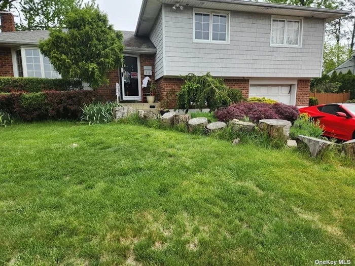 Split level home on oversized corner lot. Two baths, basement, living room and two bedrooms renovated 2019. The first floor was extended 2020 to add a sun room.
