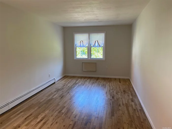 Renovated apartment. 1BR / LR / Ktch / Bth . Wood floors , heat and water incuded.