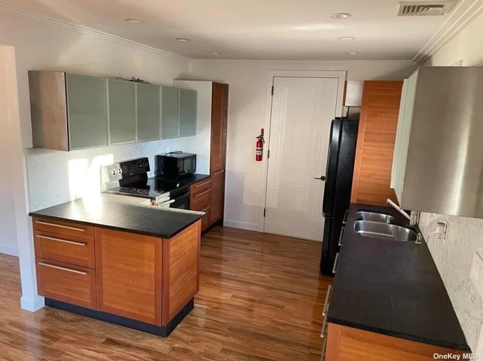 Cozy 1-bedroom apartment with all utilities included. Features include a modern kitchen, bathroom, spacious living area, and a tranquil bedroom. Near stores, mall, college and hospital.