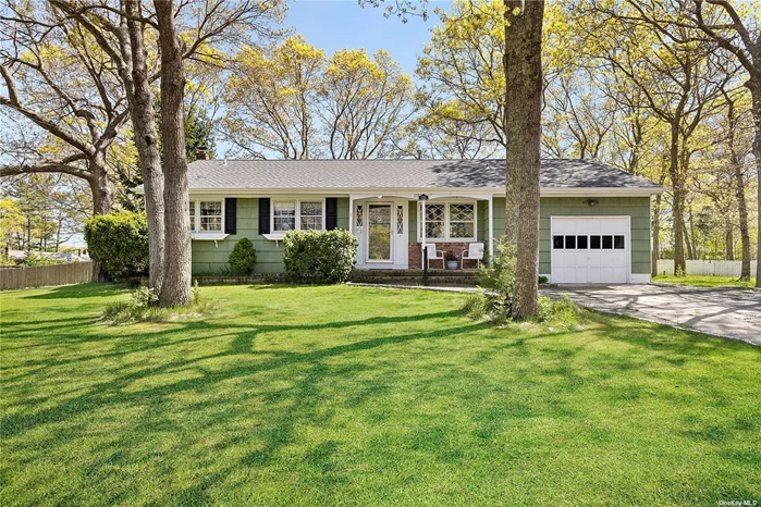 This well-kept one-level ranch house is set on .35 acres and perched on a knoll, located in Hampton Bays and within blocks of Tiana Shores Beach Club. This three-bedroom, one-and-a-half-bath home offers 1100 Square Feet of living with a living room that opens to the dining room and kitchen that open and overlooks the fenced-in large yard, plus an ensuite bedroom and two additional bedrooms that share a bath, attached garage with laundry and basement with mechanicals and storage. Outside offers a deck and patio to entertain, a shed for additional storage, and all within moments of the Bay beach and Ocean Beaches, Shops and restaurants. Room for Pool!