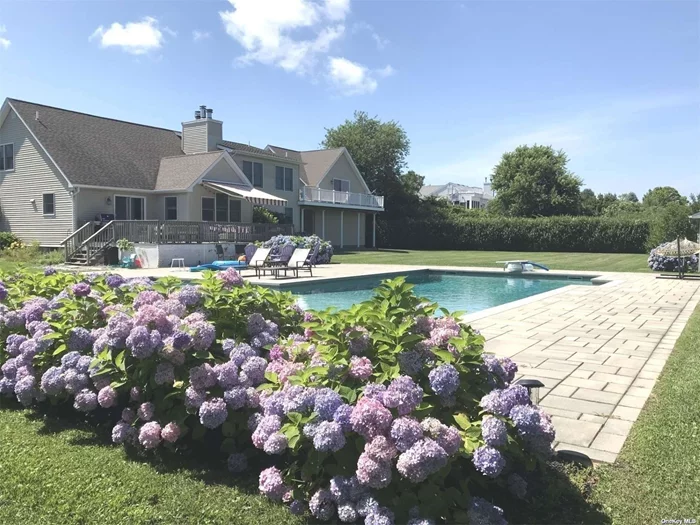 Very spacious, sunlight filled custom built beauty just 3 minutes to gorgeous LI Sound beach. 44&rsquo; x 24&rsquo; heated, saltwater pool. Open concept LR/DR/KI with sliders to expansive deck overlooking private, park-like yard and pool area. Upstairs has a large, 2nd living room with billiards, foosball, tv area & sliders to another deck. 2 primary bedrooms - one on each level. 2nd floor primary has living room area and a wet bar. Home & grounds impeccably maintained and tastefully furnished throughout. Fine dining & state park just down the road. A scenic 9 mile drive to bustling downtown Greenport. Rental Permit #1117. Exp. 5.6.26.