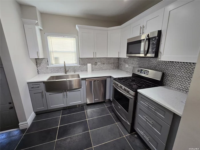 Fully Renovated Whole House In Lakeview Section Of Rockville Centre, New Kitchen With Stainless Steel Appliances. Modern Bathrooms, Hardwood Floors, Recessed Lighting Throughout, Full Basement, Spacious Backyard With Garage, Washer/Dryer, Multiple Energy Efficient Features (Boiler, Windows, Appliances Etc Etc)