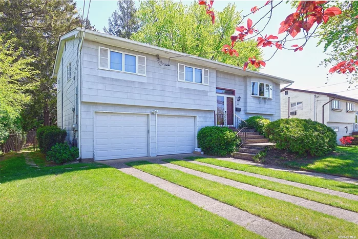 Clean, lovingly maintained and sitting pretty on a tree-lined street. Three bedroom, 2 bath Hi-Ranch boasts an open floor plan. Kitchen overlooks the back yard. Living room flows into dining area where sliders open to a spacious deck perfect for outdoor entertaining. The lower level offers endless possibilities. It is currently set up as a stand alone art studio with full bathroom. Storage is plentiful, with a laundry area, closets and an oversized two-car garage. Aside from non-working gas oven in upstairs kitchen, other appliances are in good working condition. Fenced backyard offering ample space for barbecues, gardening, and recreation. Walking distance to the LIRR, local shops, restaurants, and schools. This is an exceptional opportunity for the next owner to transform this beauty into a dream home. Taxes with star $11, 360.81. Central Air, Gas heating and cooking, 7 year old roof, in ground sprinklers, elegant flagstone front patio and maintenance free trex deck in rear. Proudly owned by one family since 1961, Needs TLC