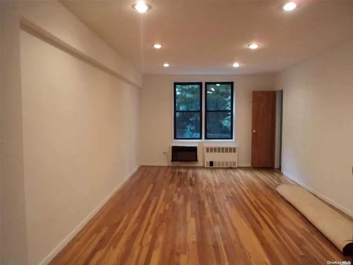 Two bedroom converted from Jr-4. Hardwood floor throughout underneath the carpet. Open concept kitchen. A few blocks from LIRR and Q12. Close to restaurants, supermarkets and stores. P.S. 98. Building is well maintained. Low maintenance, no flip tax. Waiting list on the garage. Easy street parking.