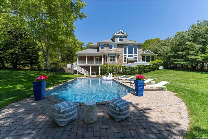 Recently renovated, luxurious summer retreat in Southampton, where timeless elegance meets modern comfort! Nestled between the serene waters of Shinnecock Bay and Peconic Bay, this exquisite rental property with cutting edge smart home technology offers a unique blend of tranquility and sophistication. As you step onto the sprawling 1.1-acre estate, you are greeted by lush greenery and manicured gardens, providing a sense of seclusion and privacy. The grandeur of the property is evident from the moment you arrive, with its impressive +6, 000 sq ft of living / entertaining space. This meticulously designed home boasts soaring ceiling heights, a beautiful open floor plan, and a fabulous fully equipped chef&rsquo;s Kitchen. Each of the four spacious bedrooms offers a private oasis of comfort and style. With four plus bathrooms, including luxurious en-suites, every detail has been carefully considered to ensure the utmost in relaxation and convenience. Taking center stage all summer long on this exceptional rental property is the stunning and sun-soaked heated pool, perfect for refreshing swims on sunny days or leisurely lounging by the water&rsquo;s edge. Surrounded by expansive patio space and elegant landscaping, the pool area provides an idyllic setting for outdoor entertaining or simply soaking up the warm Hamptons sunshine. Ideally sited and located directly overlooking the historic Stanford White estate, where the renowned artist William Merritt Chase himself enjoyed the most ideal summer lifestyle, creating and designing many of his most prized paintings. This unique locale offers guests of all ages a direct connection to a rich and diverse artistic heritage that is truly unparalleled. The panoramic views from the parlor landing provide a captivating backdrop, inviting you to unwind and immerse yourself in the natural beauty that surrounds you. Conveniently located within minutes of world-renowned Southampton Village Main St, as well as the Shinnecock Bay, where you&rsquo;ll enjoy easy access to the wide-open waters of the Bay and beyond. Whether you&rsquo;re seeking a peaceful retreat or an active summer lifestyle, this Southampton rental opportunity offers the perfect balance of luxury, tranquility, and inspiration. Now available for immediate occupancy.