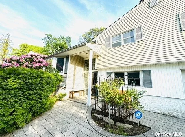 MUST SEE THIS GLEN COVE Spacious Bright 4 Bedroom 2 Bath home. This home has a Large Living Room with three skylights, a living room fireplace and first floor bedroom or home office with wood-burning stove and full bathroom. Walk up 5 steps to access the Open Dining Room, Eat-In-Kitchen with stainless appliances, new electric cooktop, large skylight and center island in this EIK. Up another 6 steps to the second floor 3 bedrooms and full bath with shower. One-car garage and a two-car space paved driveway. Partially finished Basement with W/D. Morgan Park down the block, close to schools, shopping, restaurants and roadways. Access to Glen Cove Private Beaches. Owner/agent occupied. Annual Taxes $12, 255.