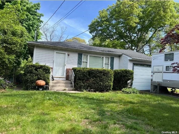 SO much potential. This 3 Bedroom 1.5 bath home includes an updated roof taken down to the plywood less than 3 yrs ago. Hardwood floors throughout and deck off the dining that leads to the spacious backyard. Full basement with one finished room. Full garage for storage. All this accessible to all local shopping and transportation.