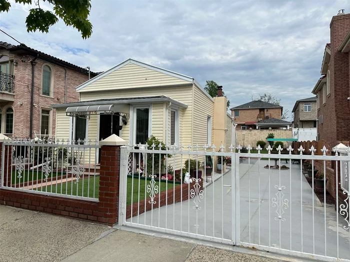 Lovely detached single family home with a two bedroom apartment, full finished basement with separate out side entrance, private driveway, 40X100 lot size,  R3-2 zoning perfect for builders, close to schools, shopping centers, public transportation, JFK airport and the casino.