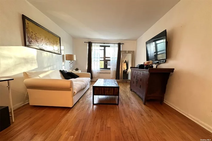 This large corner one-bedroom apartment, overlooking Cunningham Park is located at the 24HR Security, Elevator Building in a large residential oasis,  Windsor Park Co-op in Bayside, Queens. The apartment features 800sf interiors with a spacious living room with dining areas, a hallway with ample closets, a newly renovated galley kitchen with stainless steel appliances - refrigerator, gas range, brand new dishwasher, beautifully designed bathroom, recently installed new windows, and air conditioning units.  Each & every room is bright and airy. Laundry is located onsite in the basement. Assigned outdoor space and Garage parking are available. The amenities in park-like grounds include an outdoor Olympic size pool, tennis and basketball courts, children&rsquo;s playgrounds, and a newly built state-of-the-art Fitness Center. School District 26, PS 205 Alexander Graham Bell, JHS 74 Nathaniel Hawthorne, Benjamin N Cardozo High School. Low maintenance includes heat, hot water, gas, and property tax. No flip tax. Subletting is allowed after 3 years. 15% minimum down. Close to Shopping center, bank, restaurants, groceries, trails and transportation. Move-in Ready and perfectly located near all. Enjoy the convenience of the city and suburban lifestyle!