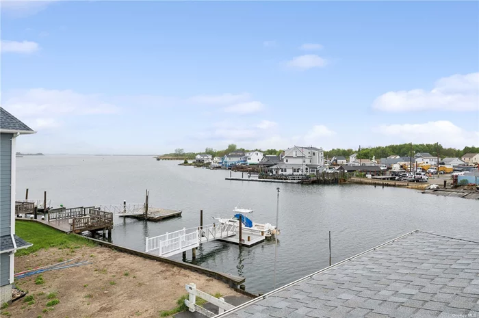 Coveted Colonial Charm Awaits in Meadowmere Park, Lawrence. This Renovated Home Features 4 Bedrooms, 2 Baths, and Stunning Waterfront Views. Enjoy Mornings by the Water with Your Coffee. Own Bulkhead Offers Endless Waterfront Possibilities. Impressively, the Lower Level Boasts High Ceilings and a Reinforced Foundation. Nearby Shopping Centers Include Stop & Shop, Lowes, and Costco. Convenient Access to Queens, Brooklyn, and Manhattan Within 30-35 Minutes. Public Transportation Makes Commuting Easy. Close Proximity to a Local Fire Department Adds Security. Experience Luxury and Tranquility in This Waterfront Oasis. Long Driveway with Large Garage. Images Virtually Staged
