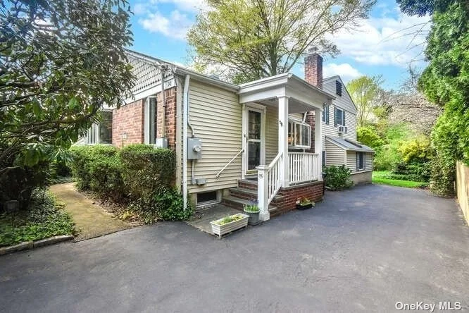 Charming Split Level Home on Park-Like Property! Updated Kitchen, Lr/Dr, Several Steps Up Leads to Primary Bedroom w/Fireplace, Den & Outside Porch, Additional Bedroom & Full Bath. Lower Level, Lr, Dining Area, Kitchen, Bedroom, Full Bath, Covered Patio. Unfinished Basement w/Utilities & Washer. Near Town Beach & Pool.