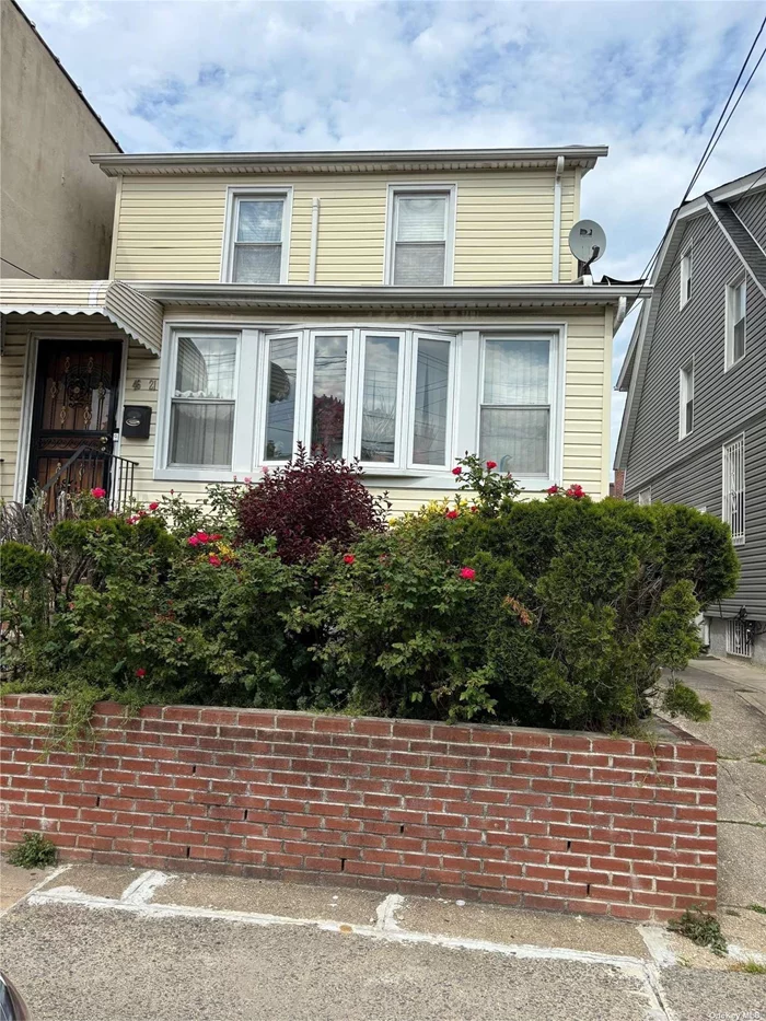 DET COLONIAL IN THE HEART OF FLUSHING WALK TO HOUSE OF WORSHIP FEATURING 3 BRS FLR FDR KIT 1 FULL BATH 2 1/2 BATHS ATTIC WITH WALK UP STAIRS PARKING FOR 4 CARS