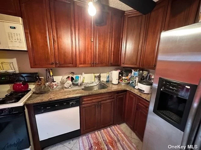 Attached townhouse style one family house with three large bedrooms 2 full bathrooms, was built in 1988 off street parking for 2 cars. House needs TLC. full unfinished basement, large kitchen, formal dining room.