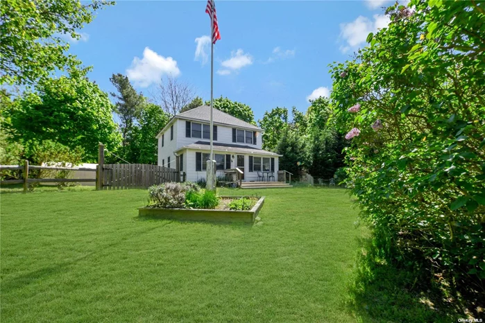 This beautiful country farmhouse in Baiting Hollow is an oasis that offers an abundance of tranquility. This two-story, 3-bedroom, 2-full bath home offers an open floor plan on the main level, as well as a dedicated office and sunroom-style space in the front of the house. The bedrooms enjoy lots of sunlight! The house sits on just below one acre of natural landscape that shares a great mix of open grassy areas and wooded views. The property features a patio, pergola, and covered outdoor grilling area to enjoy the surroundings of this breathtaking hollow. The house is set in a quiet neighborhood while still conveniently close to shopping and dining.