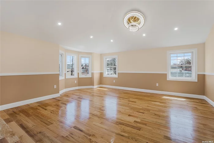 This new construction features 6 huge bedrooms, 5 full baths, 2 enclosed kitchens, huge living/dinning room, stainless steel appliances, wood flooring throughout, full finished high celling basement with inside and rear entrance, Close to all amenities