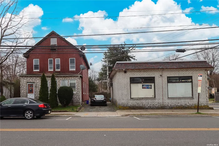 Calling all investors!!! 3 buildings on the same lot. Storefront, 2 car detached garage & a legal 2 family house. Zoned in Residence D