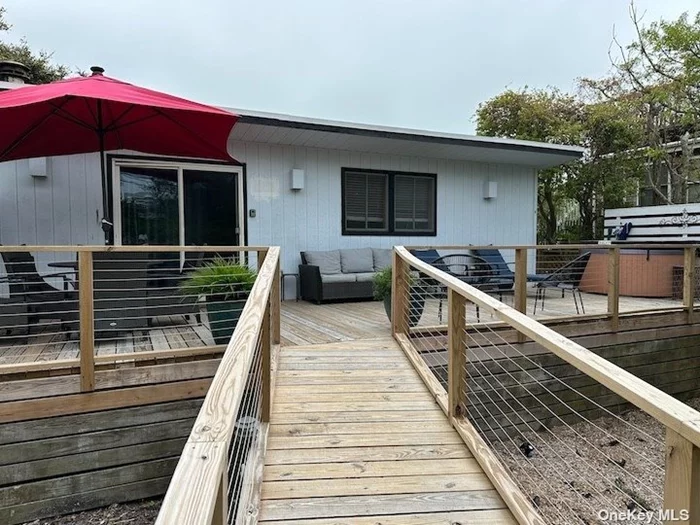 This beautifully renovated beach side, ranch-style home, on a high & dry location is a must-see! With 4 bedrooms, 2 bathrooms, two sunny decks and a hot tub. Plenty of gardening space. This well maintained property is a great income producer. Don&rsquo;t miss out on this opportunity to own a beautiful contemporary home just steps from the beach.