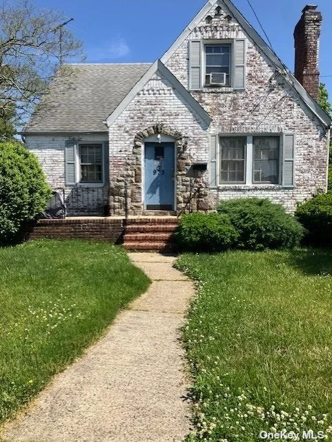 Location, Location, Location!!!  This is a large house on a corner lot with large rooms on an oversized property in a great location.  This house needs some cosmetic work but the structure, roof and interior is in great shape and live-able condition.  Plenty of potential with 2 bedrooms and a bathroom on both floors.  The large 1/2 finished basement has an outside entrance for a possible mother/daughter.  Large backyard with private driveway and detached 1 car garage.