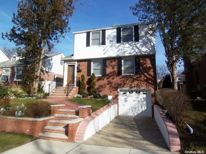 Gorgeous, move-in ready home! This well-kept colonial features 3 bedrooms, 2 full updated baths, renovated kitchen, hardwood floors throughout, finished basement with laundry, and use of the driveway and backyard. Located in Hollis Hills, in close proximity to major highways, mass transit, parks, dining, shopping, and zoned for award-winning PS 188 in SD 26!