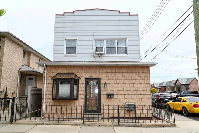 Beautiful 2 family delivered vacant, located conveniently to LI expressway. Separate entrances to both apartments. 2 bedrooms/1 bath over 3 bedrooms/1 bath with finished basement with OSE to private backyard and detached 1 car garage.
