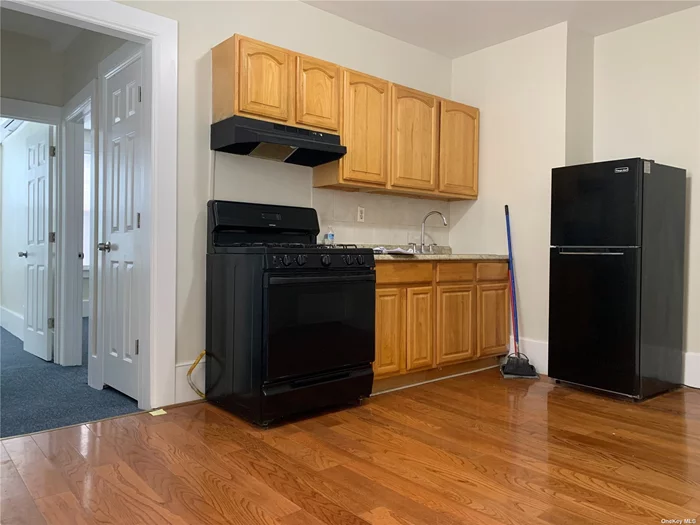 2nd floor apartment facing residential street. New carpet, toilet, window frames, and ductless cooling heating systems. Kitchen/dinning/living room combo. Close to E, F trains and conveniently located in front of Q110 bus stop. Laundromat just 1 block away. Tenant pays utilities.